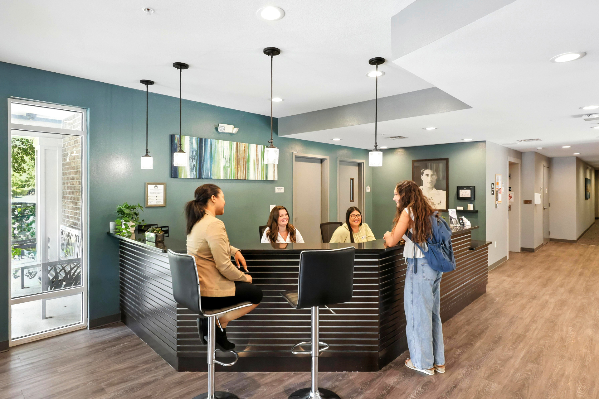 Students gathering at the front desk